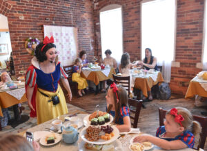Snow White enjoys tea with princesses-to-be